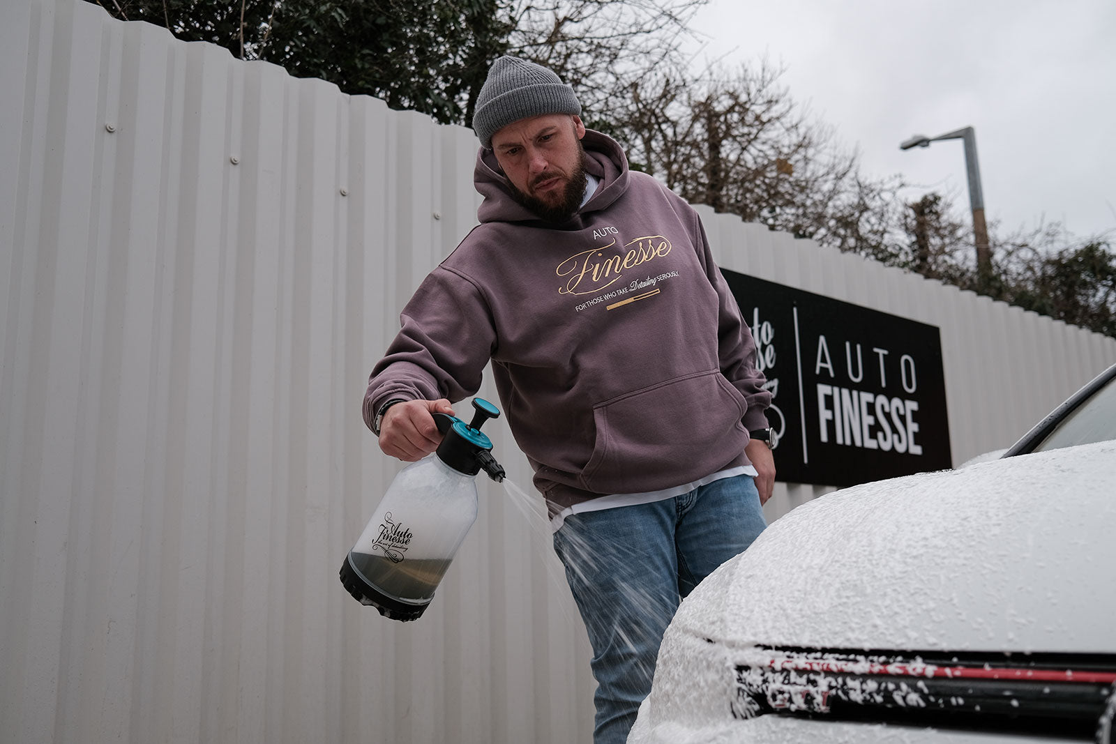 Man Wearing Serious Detailers Hoodie